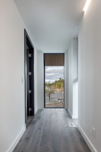 Modern Minimal Cottage Hallway Design with Lake View
