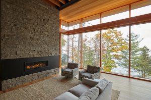 Modern Fireplace with Stone in Ontario Cottage Living Room