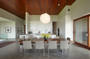Dining Room and Kitchen with Wood Ceiling and Concrete Floor